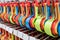 Set of colorful plastic measuring spoons hanging on rack