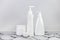 Set of cosmetic bottles, collection empty white bottles of cream with dispenser, shampoo or lotion on white background