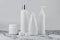 Set of cosmetic bottles, collection empty white bottles of cream with dispenser, shampoo or lotion on white background