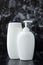 Set of cosmetic bottles. Liquid soap and shower gel, concept of hygiene. Toiletries on black marble background in bathroom