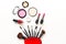 Set cosmetics makeup, brush, eye shadow and lipstick, colourful background.