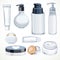 Set of cosmetics objects white jars and transparent bottles with cream or liquid isolated on a white