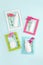 Set of cosmetics for skin care face, body, hands. White blank cosmetic bottle, tube, jar, flowers in bright frames on