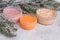 A set of creams for winter skin care on the background of fir branches, cosmetics for a modern woman, health care, spa procedures