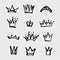 Set of crowns of different shapes and sizes painted with brush in thick paint strokes on imitation transparent background