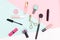 Set of decorative cosmetics, makeup tools on multicolored background. Flat lay