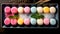 Set of delicious colorful mochi with mint leaves on a plate. Delicious Assortment of Colorful Sweet Desserts