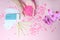 Set of depilation and beauty on pink background concept - sugar paste or hair removal waxing melted paste and stripes, orchid and