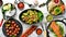 Set of diet dishes. Assortment of food on white wooden background.