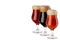 Set of different beer in wineglasses with foam - lager, red ale, porter - isolated on white background.