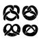 Set of different black pretzel silhouettes. Bovarian treats. Traditional German cuisine. Set of icons. Vector element