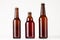 Set of different brown beer bottles 500ml and 330ml mock up. Template for advertising, design, branding identity on white wood ta