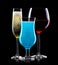Set of different cocktail glasses for drinks on black background