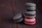 Set of different french cookies macaroons on wooden background. Closeup. Coffee, chocolate, pistachio,raspberry