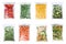 Set of different frozen vegetables in plastic bags on white background