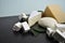 A set of different kinds of cheese - mozzarella, feta, brie, Dutch