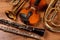 Set of different musical instruments on wooden background, closeup