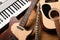 Set of different musical instruments on wooden background, closeup