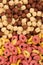 A set of different quick breakfast cereals - rings and balls, top view on white.