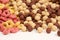 A set of different quick breakfast cereals - rings and balls, top view on white.