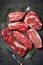 A set of different types of raw beef steaks: rib eye, Striploin, Denver, machete, top blade