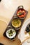 Set of dipping sauces hummus, guacamole, tomato tapenade