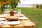 Set of dishware on table outdoors. Summer picnic