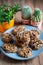 Set of easy to prepare and healthy, homemade oatmeal and blueberry cookies - on beautiful blue plate. Cookies are tied and