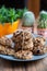 Set of easy to prepare and healthy, homemade oatmeal and blueberry cookies - on beautiful blue plate. Cookies are tied and