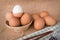 Set Eggs in a basket on gunny sackcloth background