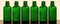 Set of empty green glass cosmetics bottles