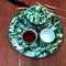 a set of enamel teapots and vintage trays