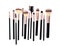 Set of essential professional make-up brushes are isolated with shadows on white background