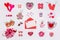 Set of feminine accessories in red and pink colors on white background. Love collection, decorative items, souvenirs, envelope.