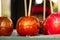 Set festive colorful caramelized apples red yellow on a wooden stick festival circus