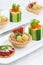 Set of festive mini appetizers, closeup, vertical