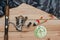 Set for fishing on the wooden background with camouflage clothing. Coil, colored floats, fishing line