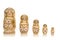 Set of five wooden matryoshka dolls standing in a row, from large to small isolated on a white background