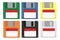 A set of floppy disks. Green, blue, yellow, orange, black, white magnetic floppy disk. Digital data device. Flat style. White