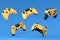 Set of flying gamer joysticks or gamepads on blue background