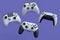 Set of flying gamer joysticks or gamepads on violet background