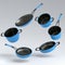 Set of flying stewpot, frying pan and chrome plated cookware on white