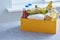 A set of foods for food in a yellow box. Copy space on a gray-blue background. Donation helps the poor, unemployed