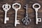 Set of four antique keys, one being different and upside down