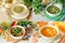 Set of four vegetable soups light mix vegetables, champignon mushrooms, broccoli celery and pumpkin puree soups -