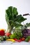 Set of fresh vegetables on a white background. bok choy pepper cabbage greens artichoke zucchini cucumber tomato