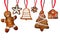 Set of gingerbread cookie figures hanging on red ribbons. Man, christmas tree, bell, stars, house