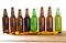 Set glass bottles of beer mock up with no label and potato chips on wooden table isolated, copy space