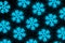 Set of glowing frozen snowflakes on dark wall. Neon effect. Large snowfalls in winter