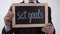 Set goals motivation written on blackboard in businessman hands, success tips